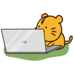 ノートパソコンを開くトラ