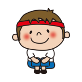 運動会で座っている赤組の子供（男の子）