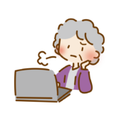 パソコンの操作をしながらため息をつくおばあさん