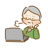 パソコンの操作をしながらため息をつくおじいさん