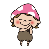 眠るポーズをしているきのこの格好をしている子供