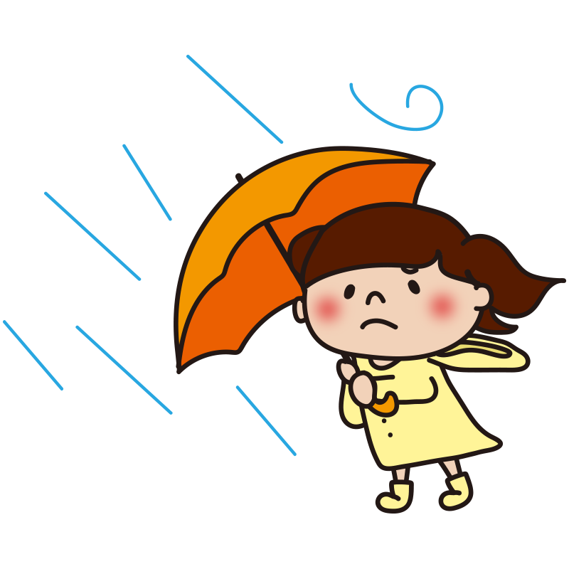 台風の強い雨風に吹かれている子供（女の子）