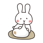 大きなお餅を食べている白いうさぎ2