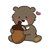 大きなどんぐりを抱えているツキノワグマ