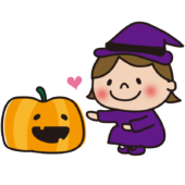 ハロウィンでジャック・オー・ランタンに触る魔女の仮装をした子供