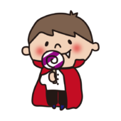 キャンディをなめるドラキュラの仮装をした子供