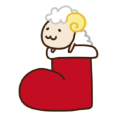 クリスマスブーツから顔を出すヒツジ
