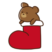 クリスマスブーツから顔を出すクマ