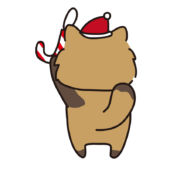 クリスマスの飾りつけをするタヌキ