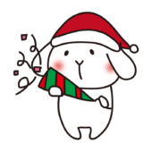 クラッカーでクリスマスのお祝いをする白いうさぎ