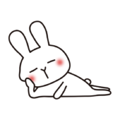 横に寝転んで寝る白いうさぎ