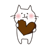 バレンタインのチョコレートを食べる白い猫