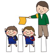 手をあげて横断歩道を渡る子供たちと旗振りをする男性1