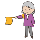 登校時の旗振りをするおばあさん1