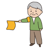 登校時の旗振りをするおじいさん1