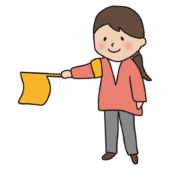 PTAの旗振り当番をする女性1