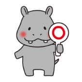 丸を出しているカバ