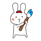 大きな筆で絵を描く白いうさぎ