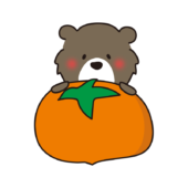 大きな柿を持っているクマ