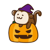 ハロウィンのカボチャに乗ったサル