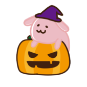 ハロウィンのカボチャに乗ったウサギ