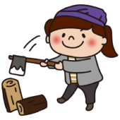 キャンプで薪を割る子供（女の子）