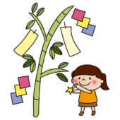 七夕飾りを飾る子供（女の子）