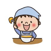 エプロンと三角巾をしてボールで卵を混ぜる子供（男の子1）