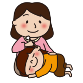 お母さんに耳かきをしてもらう子供（女の子）