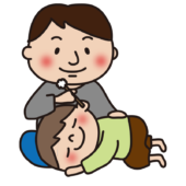 お父さんに耳かきしてもらう子供（男の子）