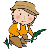 帽子をかぶって草刈りをする大人の女性2