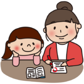 娘の勉強の採点をするママ