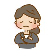 腕を組んで考えているゆるくて可愛いスーツの女性