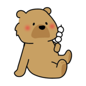 お団子を持っているヒグマ