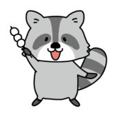 お団子を持っているアライグマ