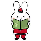 クリスマスに歌をうたっている白いうさぎ