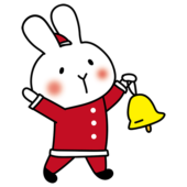 サンタの衣装でクリスマスの飾りつけをする白いうさぎ