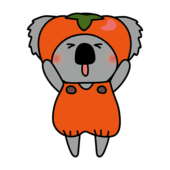 柿のかぶり物をしているコアラ