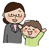 男の子の頭を撫でて褒める眼鏡をかけた女性教師