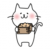 節分の豆を持っている白い猫