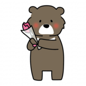 一輪の花を持っているクマ