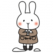 冬服で雪合戦の雪玉をつくる白いうさぎ