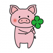 四つ葉のクローバーを持っているぶた