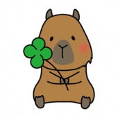 四つ葉のクローバーを持っているカピバラ