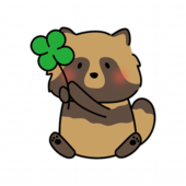 四つ葉のクローバーを持っているタヌキ