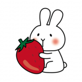 大きな苺を持っている白いうさぎ