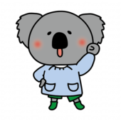 ガッツポーズをしているスモックを着たコアラ