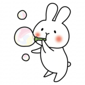 シャボン玉で遊ぶ白いうさぎ