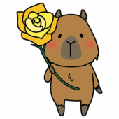 黄色い大きなバラを持っているカピバラ