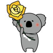 黄色い大きなバラを持っているコアラ